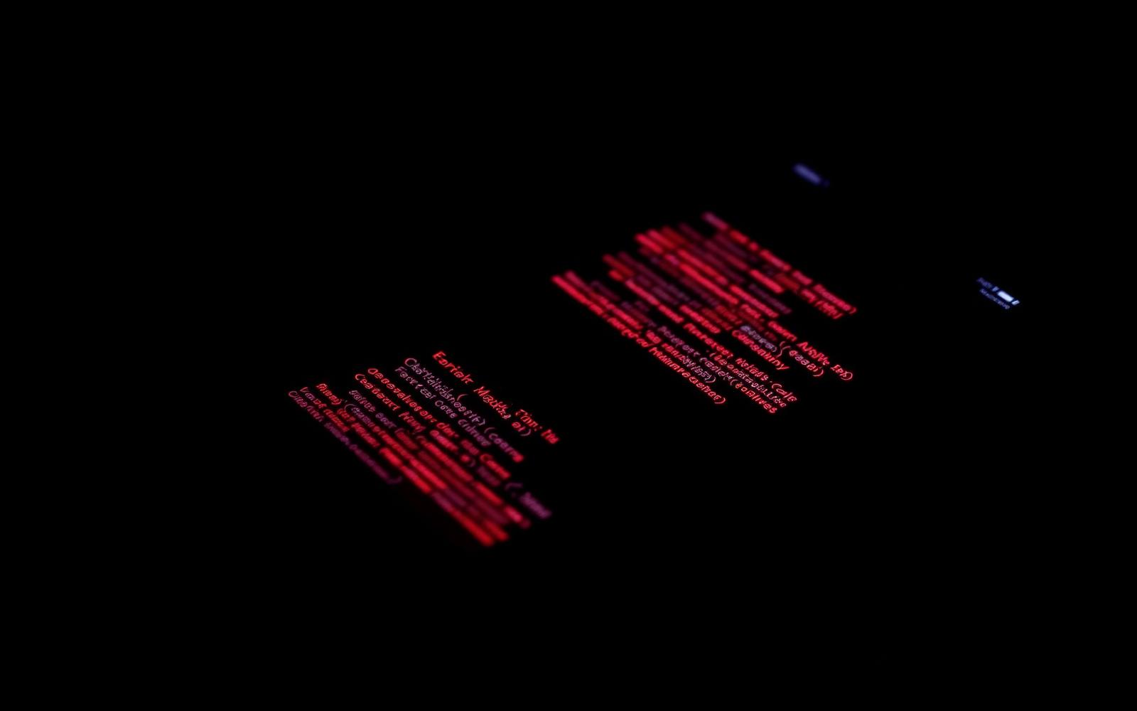 Glowing red error stack trace on a dark surface